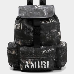 AMIRI  men’s washed canvas rucksack stencil-logo backpack.